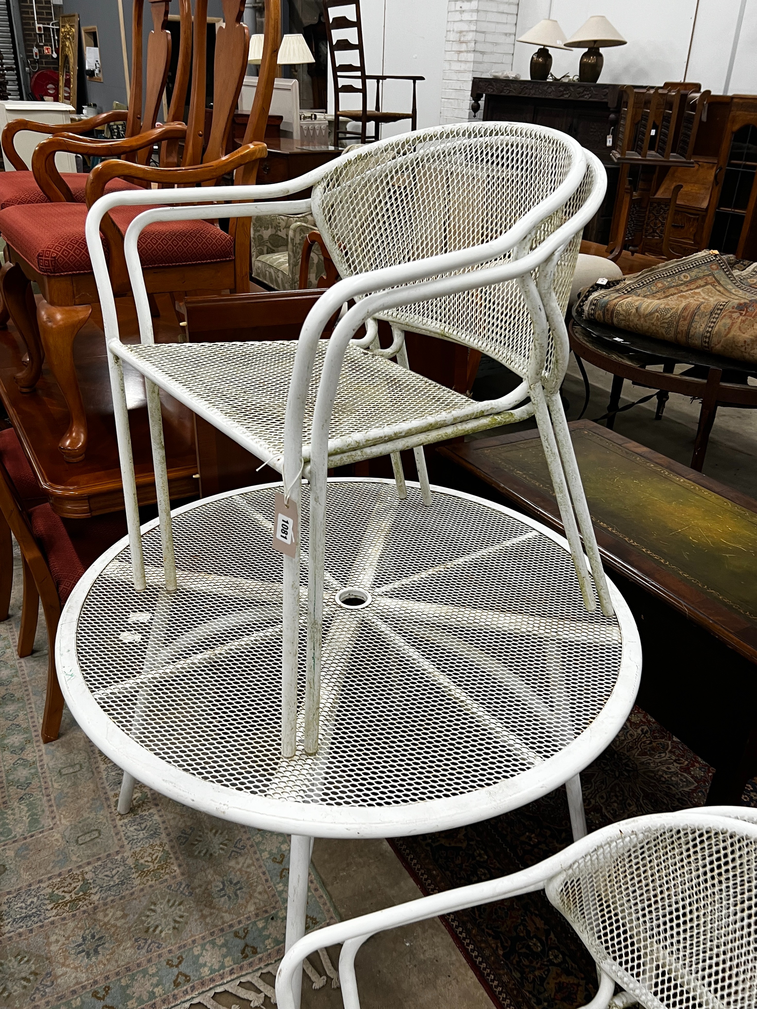 A circular painted aluminium garden table, diameter 100cm, height 72cm together with four matching stacking chairs